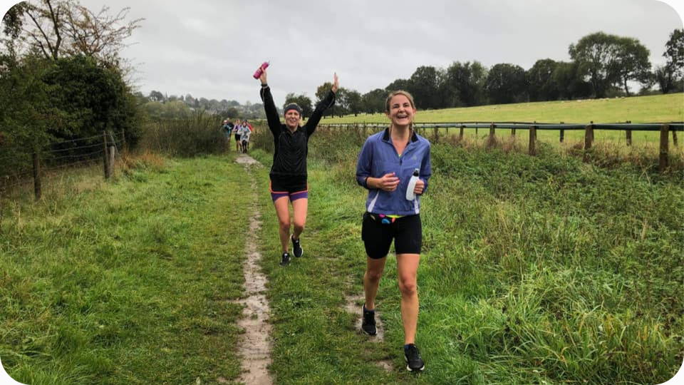 Female trail runners in the English countryside, Hertfordshire.